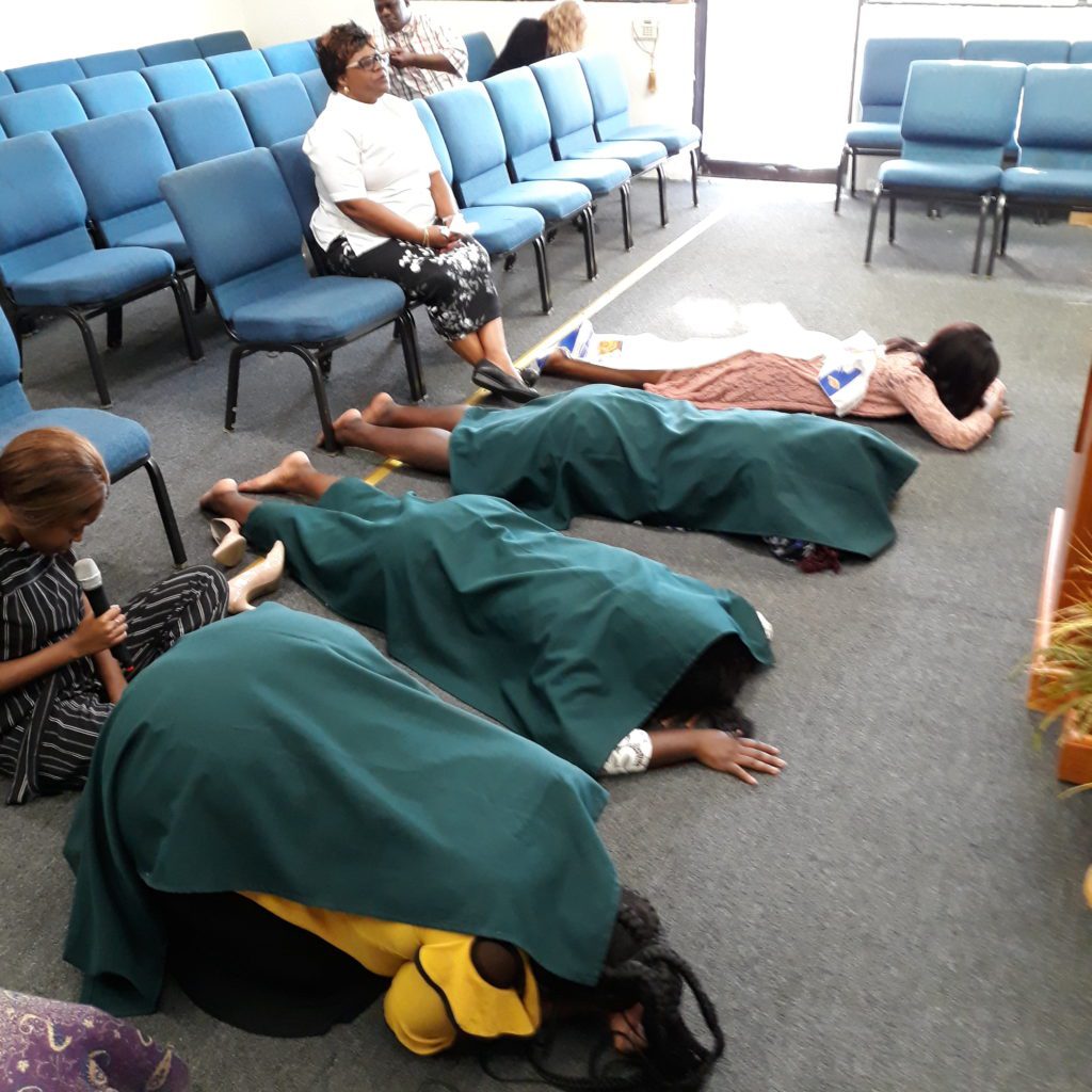 a photo of women during a worshipping service