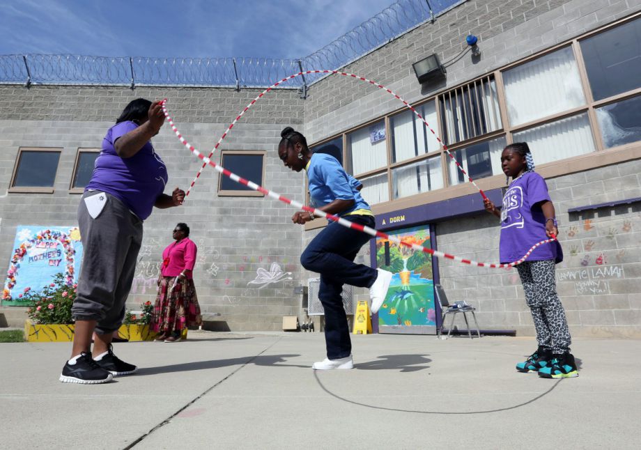a photo of children playing at a prison