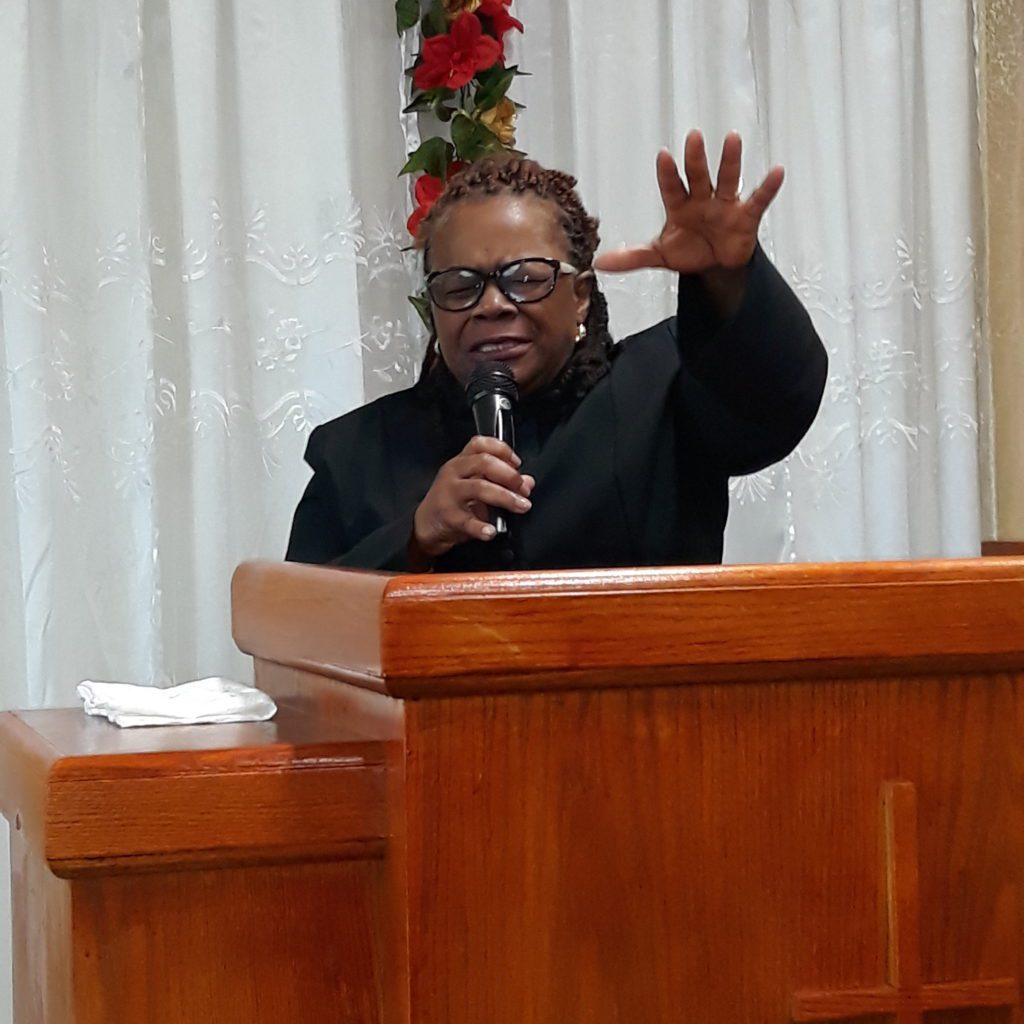 a photo of apostle betty during a church service